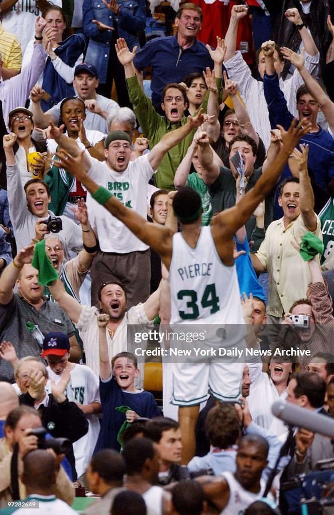 Crowd cheers wildly as Boston Celtics' Paul Pierce leaps up