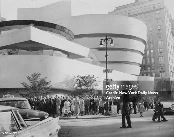 Crowd fills the corner of 89th St. And Fifth Ave. At the opening of the Solomon R. Guggenheim Museum.