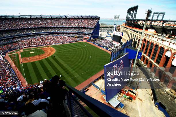 The new Citi Field is seen at right as the Mets take on the Philadelphia Phillies during the 2008 home opener.