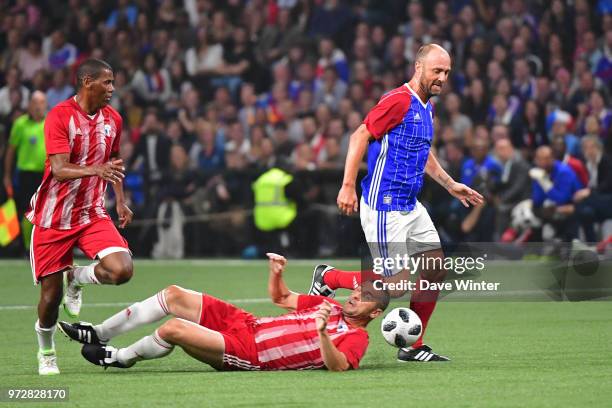 Christophe Dugarry of France anf Nisa Saveljic of FIFA 98 during the Legends Game match between France 98 and Fifa 98 at U Arena on June 12, 2018 in...