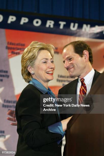 Sen Hillary Clinton is joined on stage by Attorney Gen. Eliot Spitzer at Carl McCall's election-night headquarters on Sixth Ave. McCall conceded the...