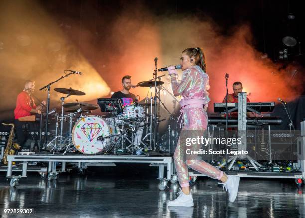 Mandy Lee and band members of Misterwives perform at DTE Energy Music Theater on June 12, 2018 in Clarkston, Michigan.