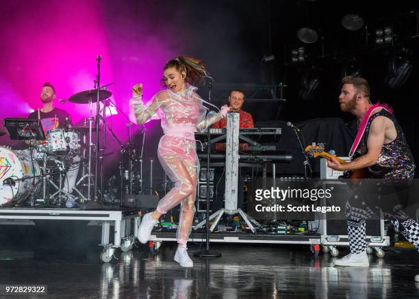 Mandy Lee and band members of Misterwives perform at DTE Energy Music Theater on June 12, 2018 in Clarkston, Michigan.