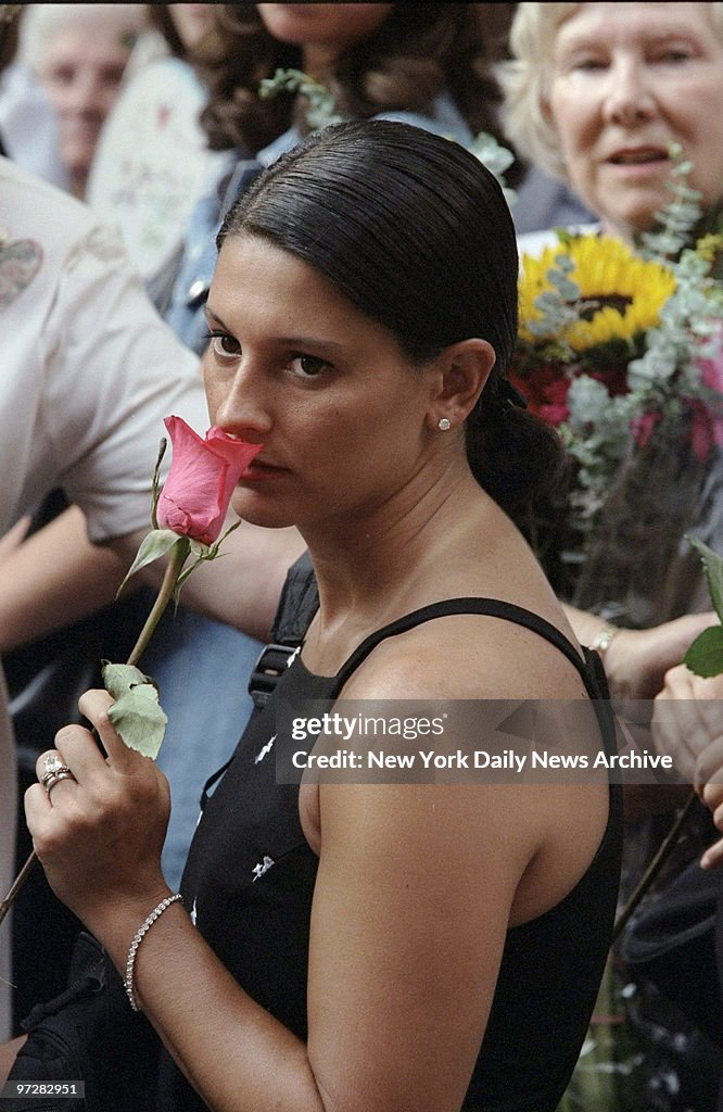Jamie Setchell Jamie Gottschell of Jersey City, holds a single red rose outside Old ...