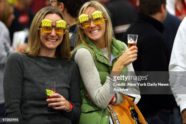 Jamie Shurbert and Danielle Ryniker laugh as they look through the proverbial "beer goggles" during Brewtopia, a beer festival held at the Jacob K....