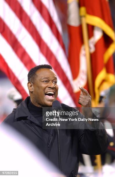 Luther Vandross sings the national anthem before football game between the New York Jets and the San Francisco 49ers at Giants Stadium. The 49ers...