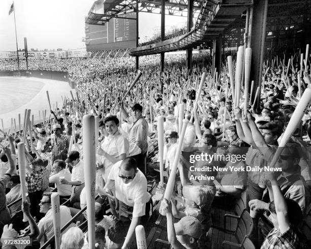 Crowd of 62,582 most with bats at Yankee Stadium during Bat Day.