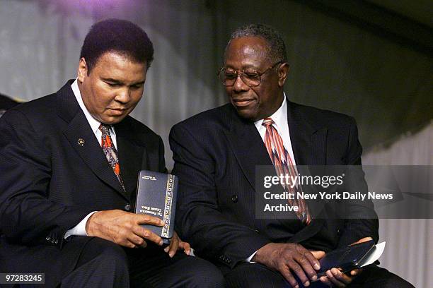 Former heavyweight champ Muhammad Ali and baseball legend Hank Aaron get together after they were presented with Presidential Citizens Medals at the...