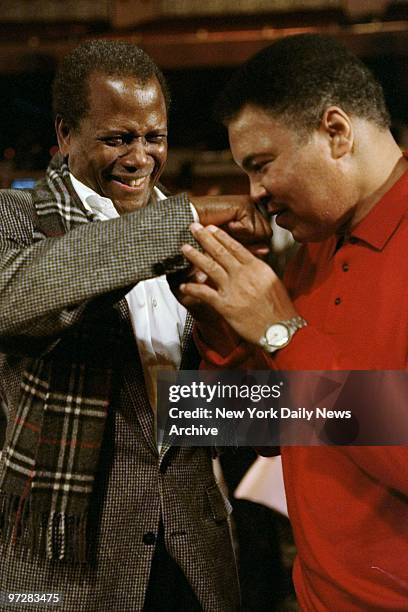 Former heavyweight champ Muhammad Ali isn't exactly bowled over by Sidney Poitier's right to the schnozz at rehearsal for the fifth annual ESPY...