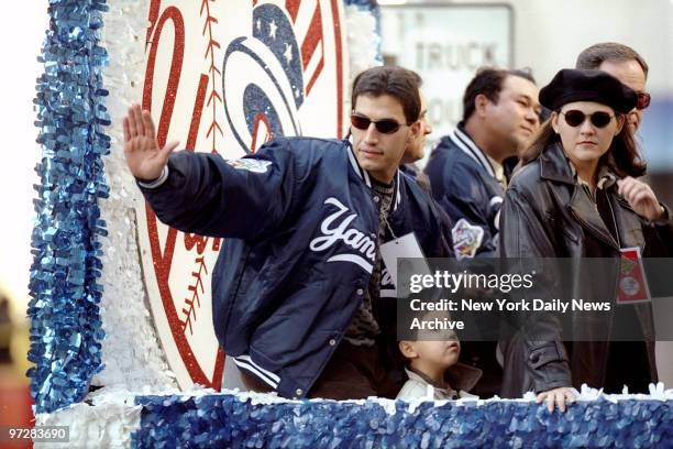 New York Yankees' Andy Pettitte waves from float during ticker tape parade held in honor of the Yankees' World Series victory.