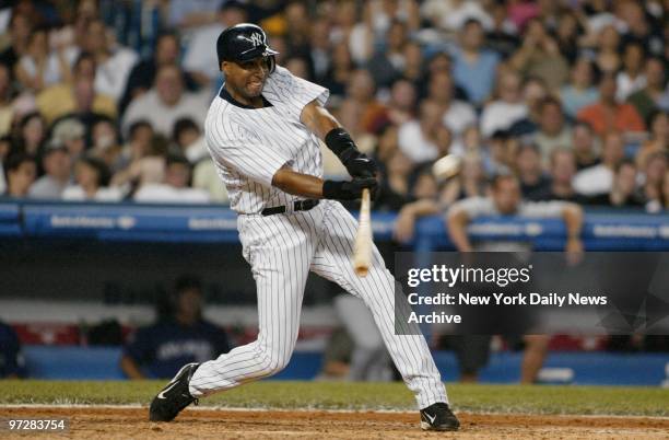 New York Yankees' Bernie Williams hits a solo homer against the Colorado Rockies at Yankee Stadium. The Yanks won, 7-5.