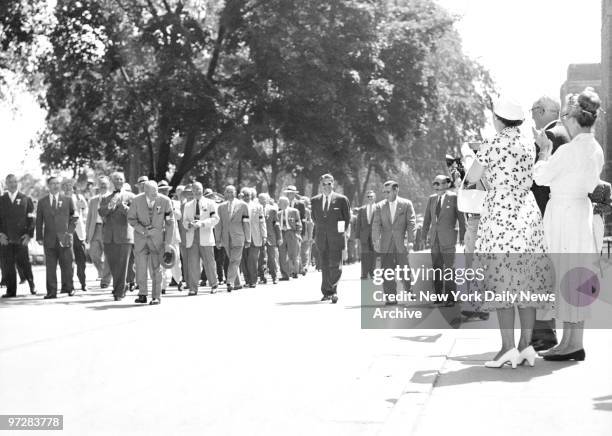 Makes Presidential Bow at West Point. President Eisenhower makes low bow to his wife, Mamie , as he marches in alumni parade at West Point. Ike...