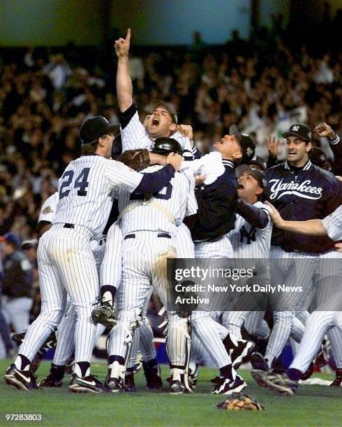 New York Yankees celebrate after beating the Atlanta Braves 3-2 in Game 6 to win the 1996 World Series.