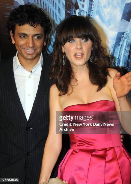 Night Shyamalan with his star Zooey Deschanel at the Twentieth Century Fox Premiere of "The Happening" held in the Ziegfeld Theater