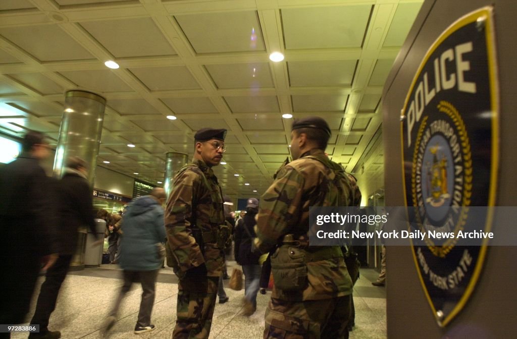 National Guard troops stand watch at Penn Station after the