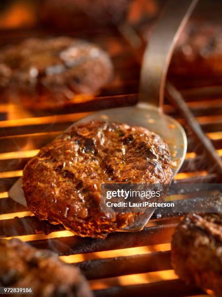 hamburgers on the bbq - spatula stock pictures, royalty-free photos & images