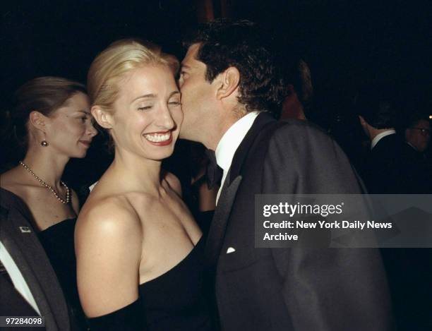 Carolyn Bessette Kennedy is amused by the whisperings of her husband, John F. Kennedy Jr., at the Municipal Art Society gala at Grand Central...