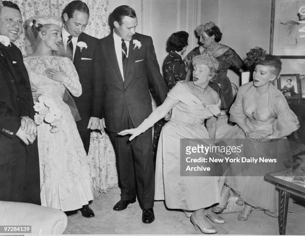 Mama Joli Gabor and her daughter Zsa Zsa look over new bride Eva Gabor after she was married to Dr. John Williams.