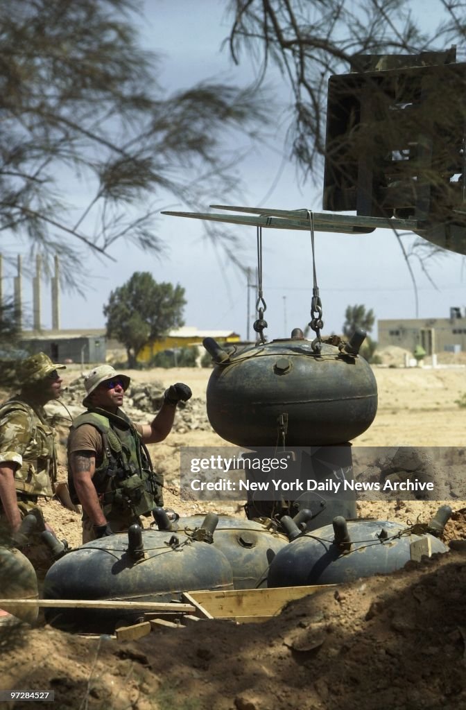 Navy Seabee Mike Midonia, 41, of Forked River, N.J., guides