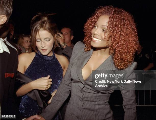 Janet Jackson and Lisa Marie Presley arrive at a party in the Chrysler Building for the release of Jackson's new record.