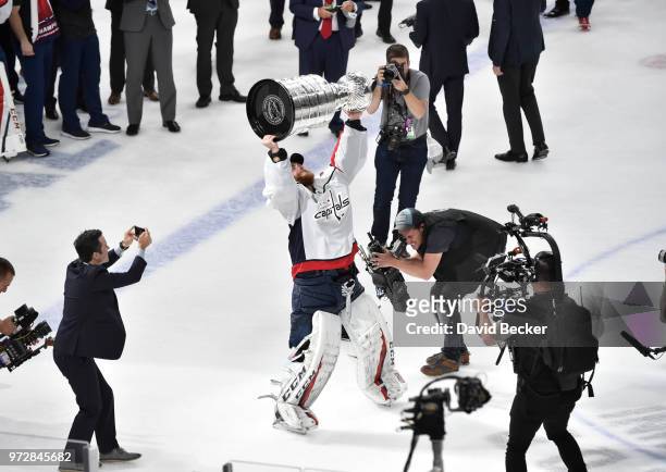 Goalie Braden Holtby of the Washington Capitals hoists the Stanley Cup after the team's 4-3 win over the Vegas Golden Knights in Game Five of the...