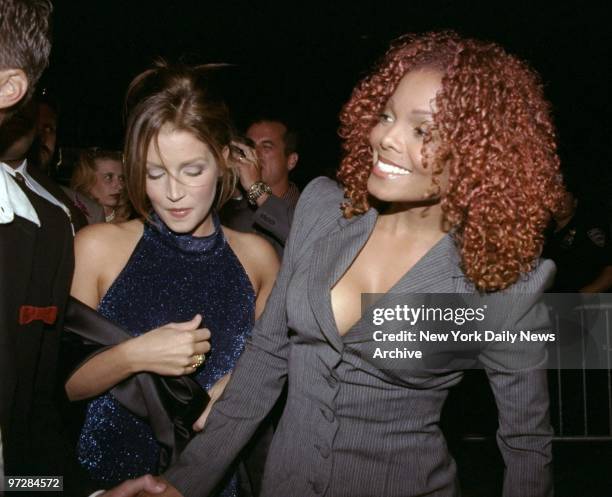 Janet Jackson and Lisa Marie Presley arrive at Janet's record listening party in the Cloud Room at the Chrysler Building.