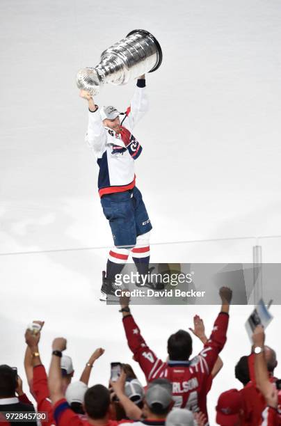 Lars Eller of the Washington Capitals hoists the Stanley Cup after the team's 4-3 win over the Vegas Golden Knights in Game Five of the 2018 NHL...