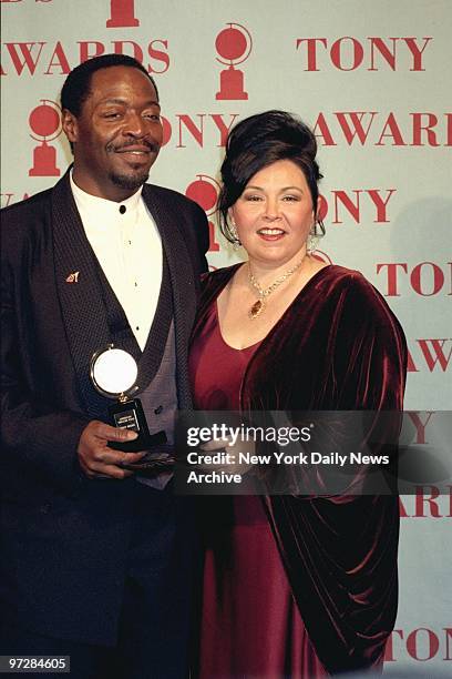 Chuck Cooper, winner Best Featured Actor in a Musical for "The Life," with presenter Roseanne Barr at the Tony Awards.