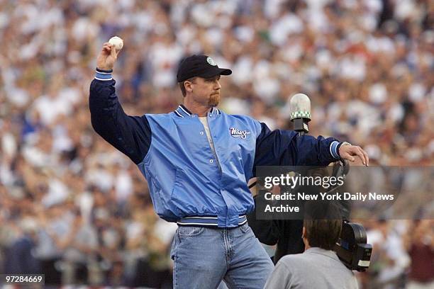 Mark McGwire throws first pitch to begin game four of the World Series between the New York Yankees and the San Diego Padres at Qualcomm Stadium.