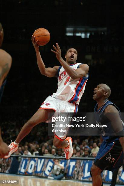 The New York Knicks' Latrell Sprewell drives past the Washington Wizards' Michael Jordan in second half action at Madison Square Garden. Jordan, in...