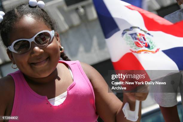 Nazaret Mencia comes out to celebrate the Dominican Day Parade on the Grand Concourse in the Bronx.