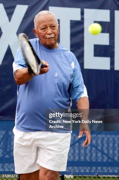 Former Mayor David Dinkins returns the ball during a volley during a match at the GHI Bronx Tennis Classic Tournament at Crotona Park. Dinkins and...