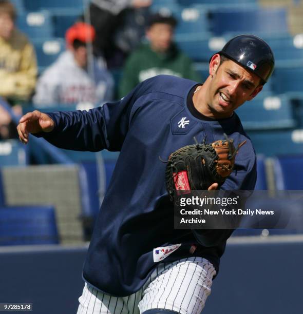 New York Yankees' catcher Jorge Posada fields a ball during pop-up drill at Legends Field as part of spring training.