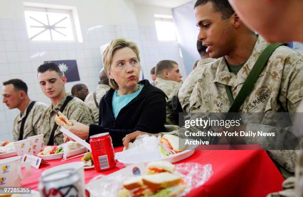 Sen. Hillary Clinton talks with Marines from New York at her table, Lance Cpl. Ilya Kaufman of Brooklyn, Lance Cpl. Kevin Kerbis of Staten Island and...