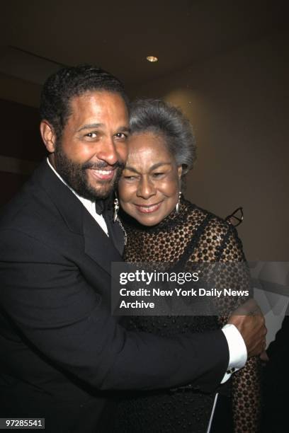 Bryant Gumbel hugs Rachel Robinson, wife of the legendary baseball player Jackie Robinson, at ESPY party at the Museum of Modern Art.,