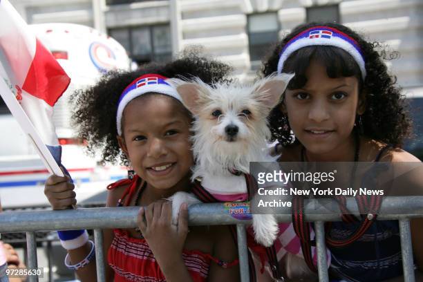 Jasmin Santana Jelise Santana with 3 year old Princess, enjoy the Dominican Day Parade on the Grand Concourse in the Bronx .,