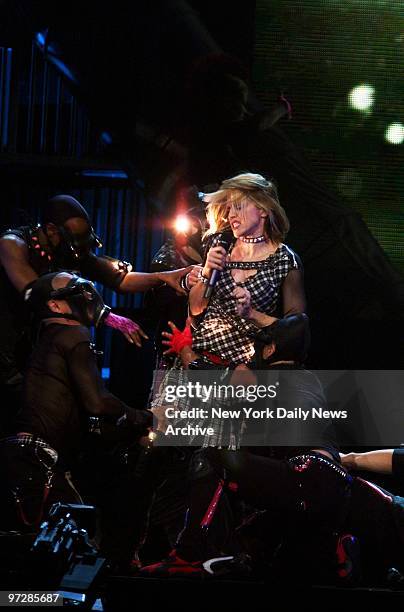 Madonna performs at the kickoff of the U.S. Leg of her "Drowned World" tour at the First Union Center in Philadelphia.