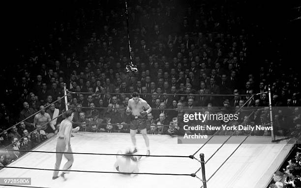 Buddy Baer is knocked to the canvas during first round action against Joe Louis at Madison Square Garden. Louis retained World Heavyweight title with...