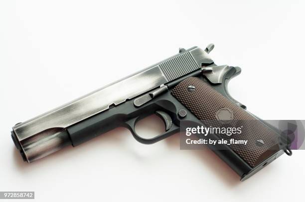 handgun pistol isolated on a white background - 9mm pistol stock-fotos und bilder