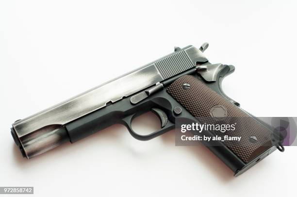 handgun pistol isolated on a white background - 9mm semi automatic stock-fotos und bilder