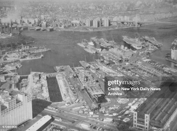 The New York Naval Shipyard, Brooklyn, is a busy place - work on no less than five of the Navy's largest ships, all aircraft carriers, is in...