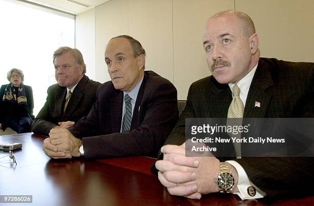 Former Mayor Rudy Giuliani is flanked by former Fire Commissioner Thomas Von Essen and former Police Commissioner Bernard Kerik as they talk about...