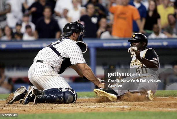 New York Yankees' catcher Jorge Posada tags Pittsburgh Pirates' Matt Lawton out during the sixth inning of a game at Yankee Stadium. After a dismal...