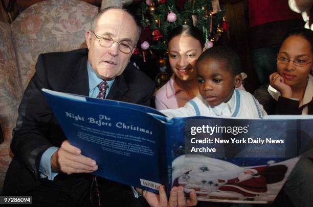 Former Mayor Rudy Giuliani reads "'Twas the Night Before Christmas" before passing out gifts to kids at Hale House, the Harlem-based organization...