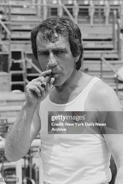 Shakespeare in the Park producer Joseph Papp puffs on a cigar during rehearsal of "Henry V" at the Delacorte Theatre in Central Park.