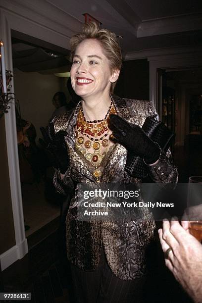 Sharon Stone tries on a necklace at designer Tony Duquette's shop in Bergdorf Goodman's. Stone is in town to film the thriller "Gloria.",