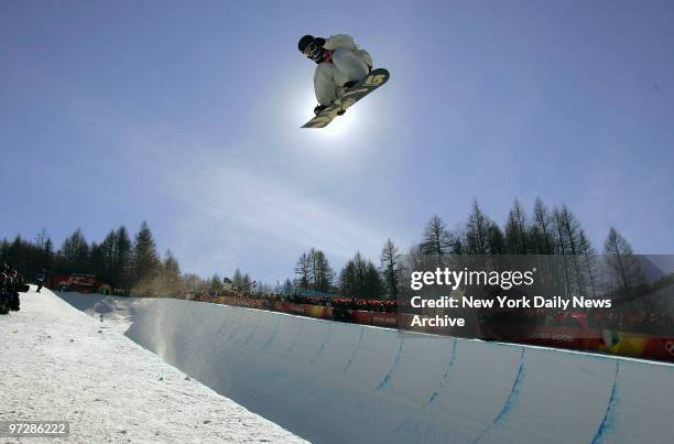 Shaun White of the U.S. Gets some air during a qualification run in the Men's Snowboard Halfpipe competition in Bardonecchia during the 2006 Winter...