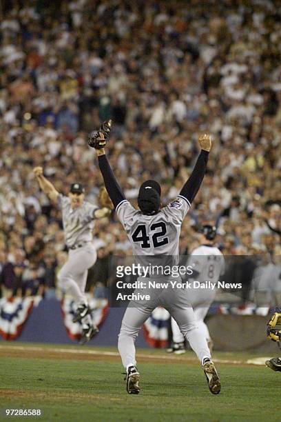 The New York Yankees celebrate following their 3-0 victory in game four of the 1998 World Series against the San Diego Padres at Qualcomm Park in San...