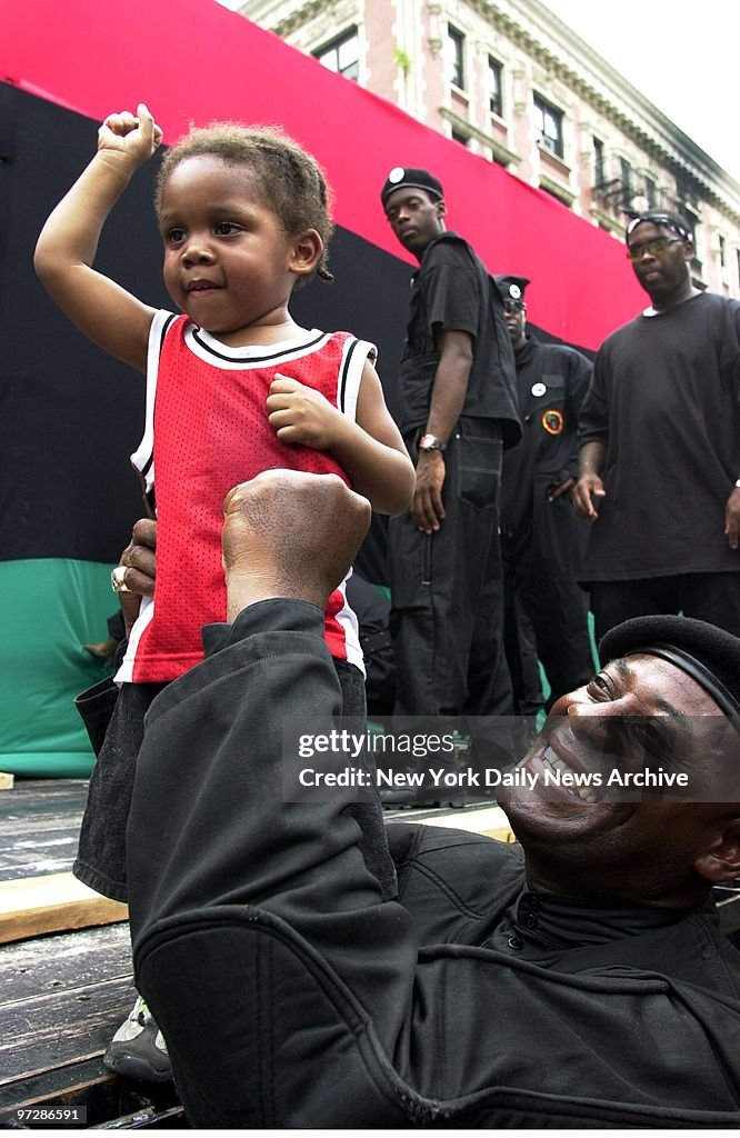 New Black Panther party leader Khalid Abdul Muhammad holds l
