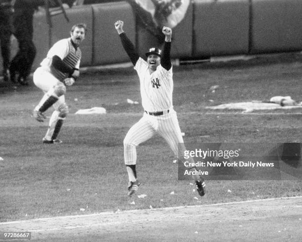 New York Yankees' Chris Chambliss jumps for joy after connecting on the first pitch from Mark Littell of the Kansa City Royals in the bottom of the...